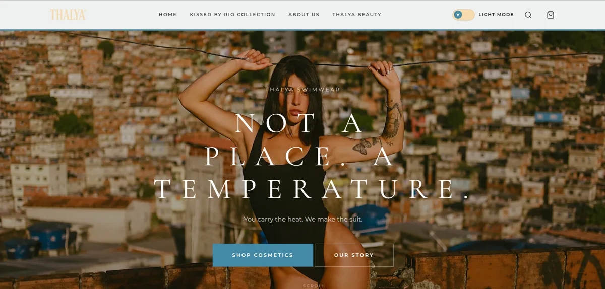 Hero do site da Thalya Swimwear em modo claro, com a frase Not a Place. A Temperature. sobre a paisagem do Rio